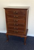 An Edwardian three drawer filing unit on cabriole