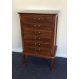 An Edwardian three drawer filing unit on cabriole