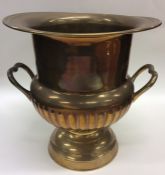 A silver plated half fluted wine cooler on taperin