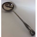 A heavy silver kings' pattern soup ladle. Sheffiel