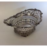 An attractive pierced silver sweet dish on bracket