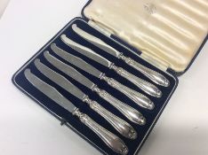 A boxed set of six silver handled knives. Sheffiel