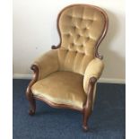 A Victorian mahogany button back nursing chair on