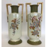 A pair of tall decorative vases, the front panel w