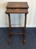 A nest of two rosewood tables, the rectangular top