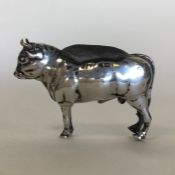 An unusual silver pin cushion in the form of a bul