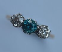 A good diamond and zircon three stone ring in plat