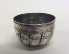 A small Russian silver beaker with fluted decorati