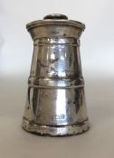 A silver churn shaped pepper grinder. Birmingham.