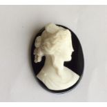 An unmounted hard stone cameo of a lady. Approx. 2