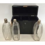 A boxed set of three silver mounted glass decanter