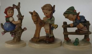 A group of three Hummel figures of children. Est.