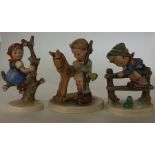 A group of three Hummel figures of children. Est.