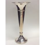 A massive silver tapering spill vase on spreading
