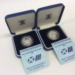 A boxed Royal Mint silver £2 coin together with on