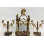 A good French brass mounted clock garniture attrac