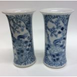 A pair of Chinese blue and white vases decorated w