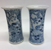 A pair of Chinese blue and white vases decorated w