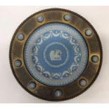 A 19th Century Wedgwood trophy plate in brass sur