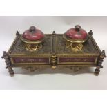 A good Continental brass inkwell decorated with sc