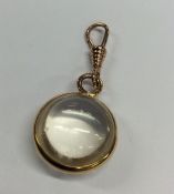 An unusual gold mounted crystal pendant with loop