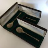 Three boxed silver christmas presentation spoons.