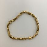 A 9 carat modern fancy link bracelet with ring cla