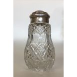A glass and silver mounted sugar shaker with lift-