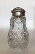 A glass and silver mounted sugar shaker with lift-