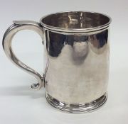 A Georgian silver pint mug on spreading foot with