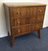 An Art Deco walnut veneered chest of three drawers