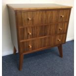 An Art Deco walnut veneered chest of three drawers