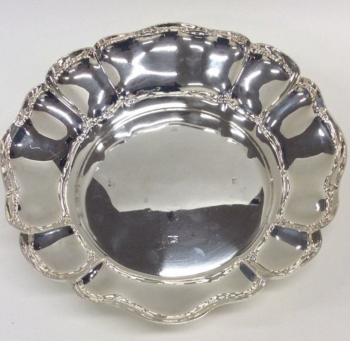 A heavy silver strawberry dish with wavy edge. Bir - Image 2 of 2