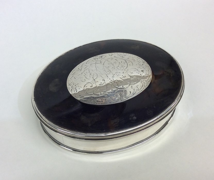 A Georgian oval tortoiseshell and silver snuff box