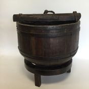 An unusual cheese barrel with ring loop top on ped