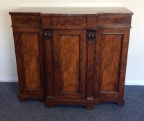 A late Georgian break front mahogany sideboard wit