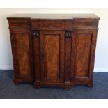 A late Georgian break front mahogany sideboard wit