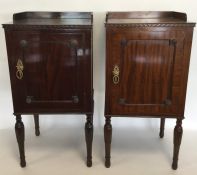 A pair of mahogany bedside cabinets with panelled