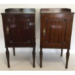 A pair of mahogany bedside cabinets with panelled