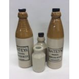 A group of stoneware bottles. Est. £20 - £30.