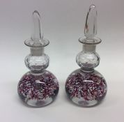 A pair of good scent bottles in the form of paperw