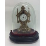 A small French brass mounted mantle clock containe