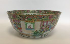 A massive Canton decorated bowl with gilded border