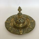 A heavy large circular inkwell with hinged top. Es