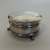 A small silver ring box with hinged top. Approx. 7