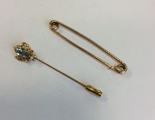 A small gold brooch together with a gold and pearl