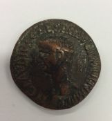 An Antique copper Roman coin decorated with a figu