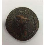 An Antique copper Roman coin decorated with a figu