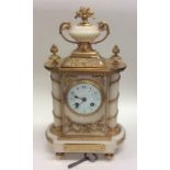 An attractive French marble and brass mantle clock