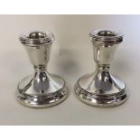 A good pair of small circular silver piano candles